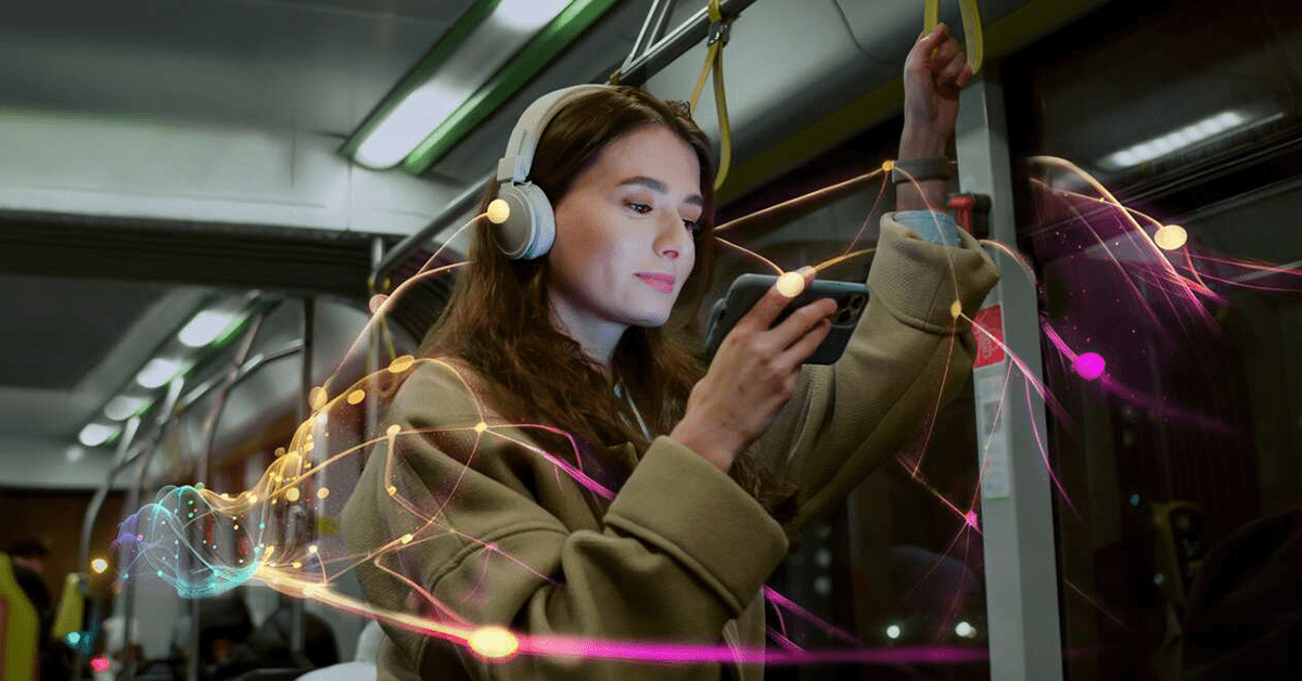 Woman on bus looking on phone.