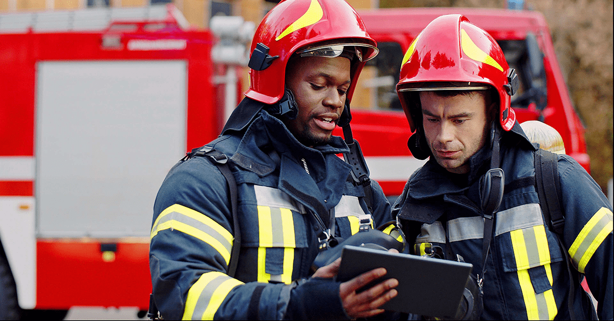 Two firefighters in operation.