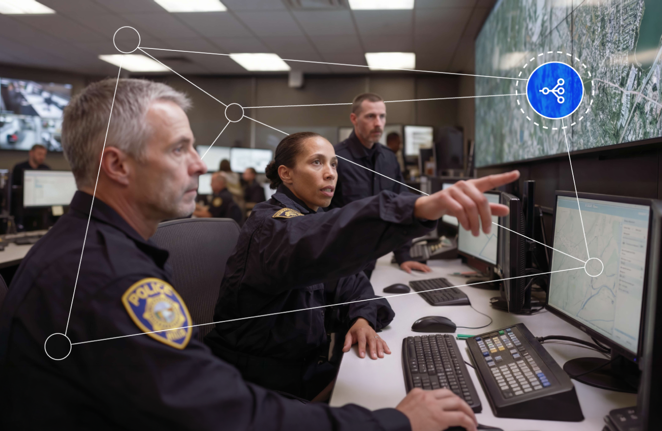 Police officers monitor maps and data on screens in a command center, with a network connectivity graphic overlay.