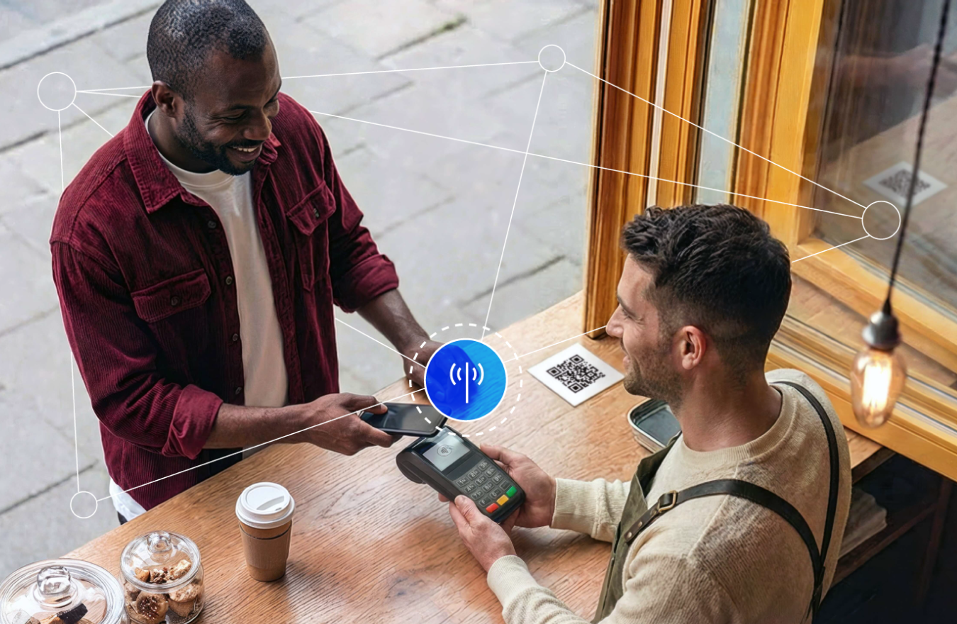 A customer makes a contactless mobile payment at a café, with a wireless connectivity graphic overlay.